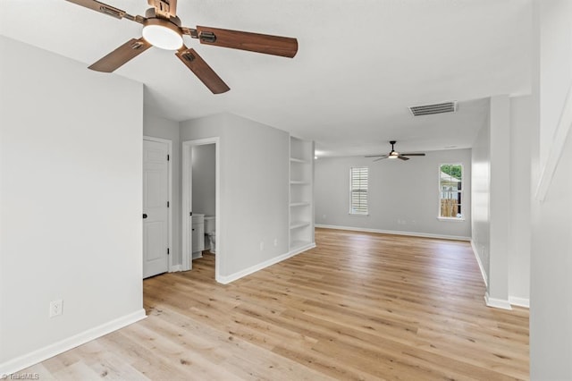 305 Apple Ridge Rd, Greensboro, NC 27406 - unfurnished room with a ceiling fan, light wood-type flooring, and built in shelves