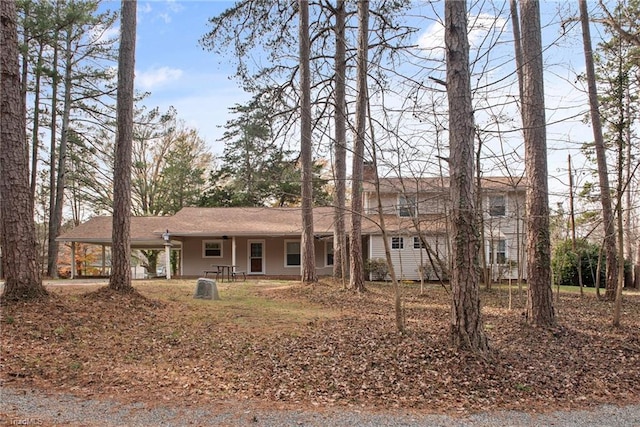 single story home featuring a carport