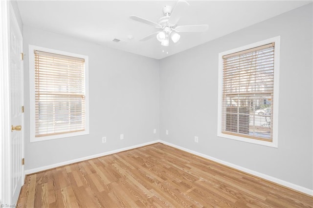 unfurnished room with light hardwood / wood-style flooring and ceiling fan