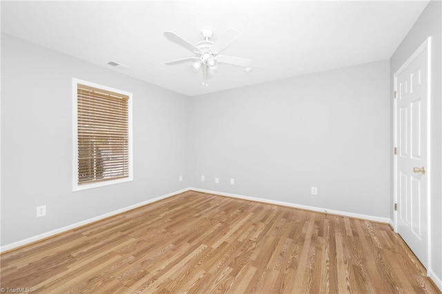 spare room with ceiling fan and light hardwood / wood-style floors