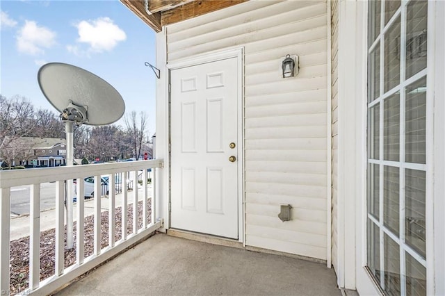 property entrance with a balcony