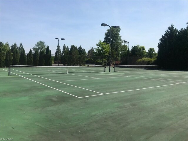 750 Palomino Mustang Dr Unit 692, Whitsett, NC 27377 - view of tennis court with community basketball court