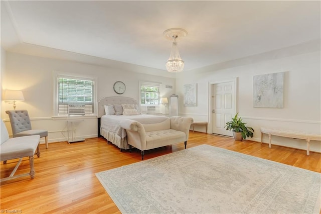 17 E Main St, Thomasville, NC 27360 - bedroom with a chandelier and light wood-style flooring