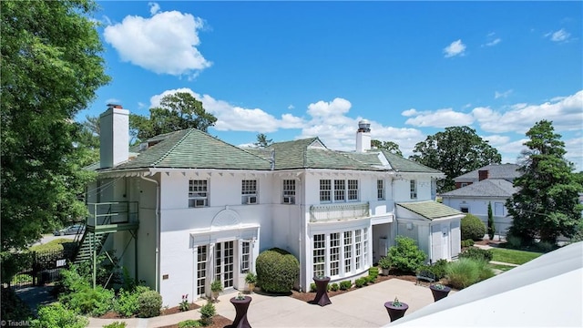 17 E Main St, Thomasville, NC 27360 - back of house with a chimney, stucco siding, french doors, and a balcony