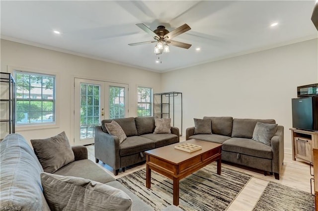 17 E Main St, Thomasville, NC 27360 - living room featuring plenty of natural light, light wood-style flooring, a ceiling fan, french doors, and ornamental molding