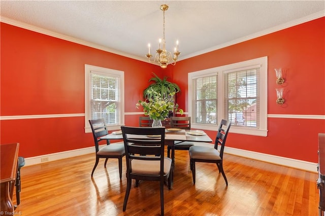 17 E Main St, Thomasville, NC 27360 - dining room with a chandelier, crown molding, light wood-style flooring, and a textured ceiling