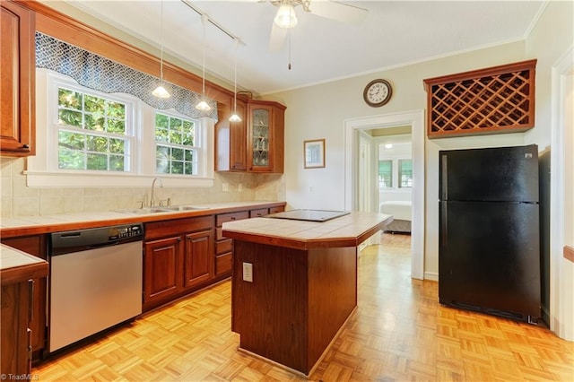 17 E Main St, Thomasville, NC 27360 - kitchen featuring black appliances, tile counters, ceiling fan, a center island, and crown molding
