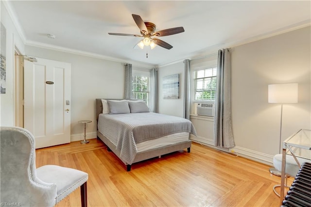 17 E Main St, Thomasville, NC 27360 - bedroom featuring ornamental molding, cooling unit, ceiling fan, and light wood-type flooring