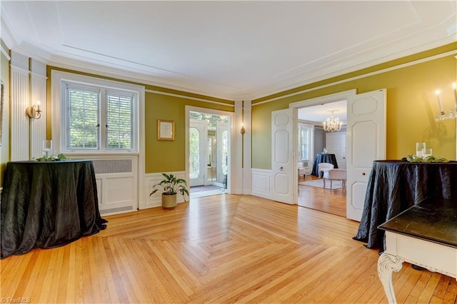 17 E Main St, Thomasville, NC 27360 - entrance foyer featuring a chandelier, crown molding, wainscoting, and a decorative wall