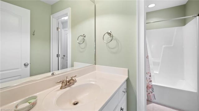 full bathroom featuring tile patterned flooring, shower / bath combo, and vanity