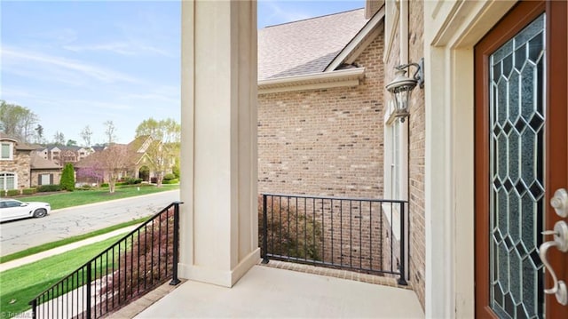 exterior space featuring covered porch and a residential view