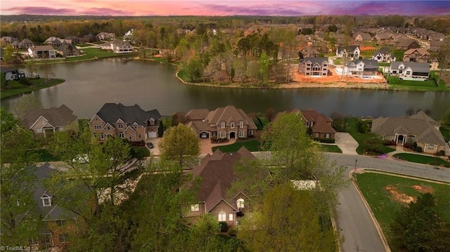 bird's eye view with a residential view and a water view