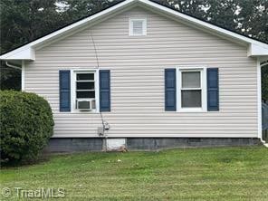 view of home's exterior with a lawn