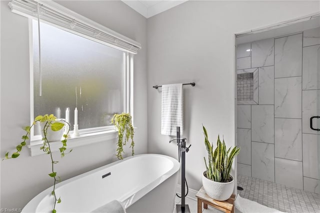 bathroom featuring shower with separate bathtub