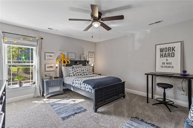 bedroom with dark colored carpet and ceiling fan