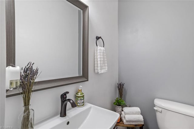 bathroom featuring sink and toilet