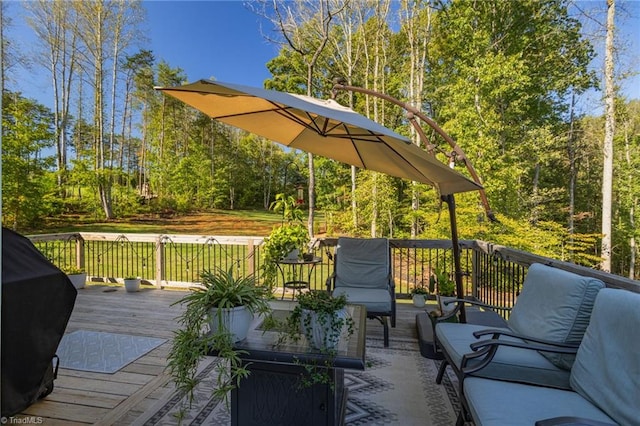 wooden deck featuring an outdoor hangout area