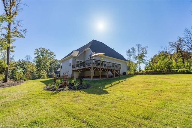 back of property featuring a deck and a yard