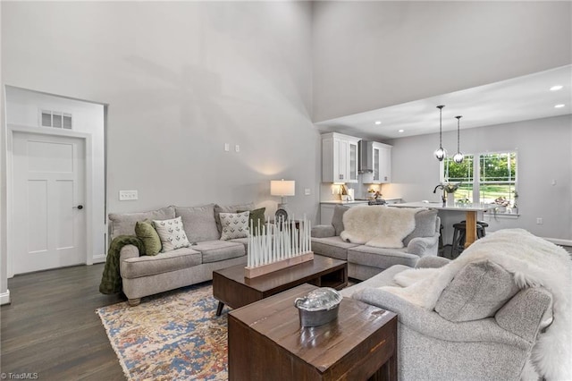 living room with dark hardwood / wood-style floors