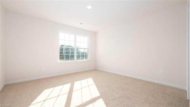 view of carpeted spare room