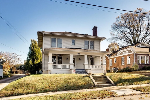 view of front of property featuring a porch and a front lawn