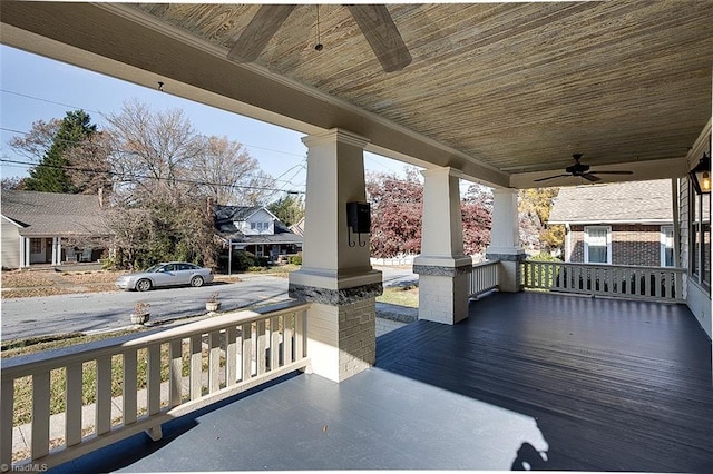 wooden deck featuring ceiling fan and a porch