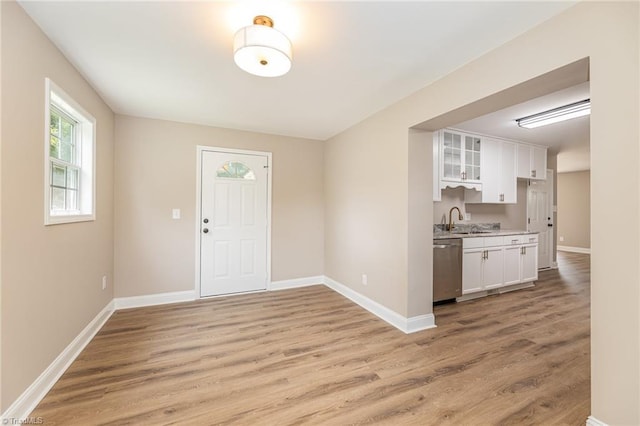 4353 Valley View Rd, Thomasville, NC 27370 - kitchen with a sink, light wood-style floors, white cabinetry, and stainless steel dishwasher