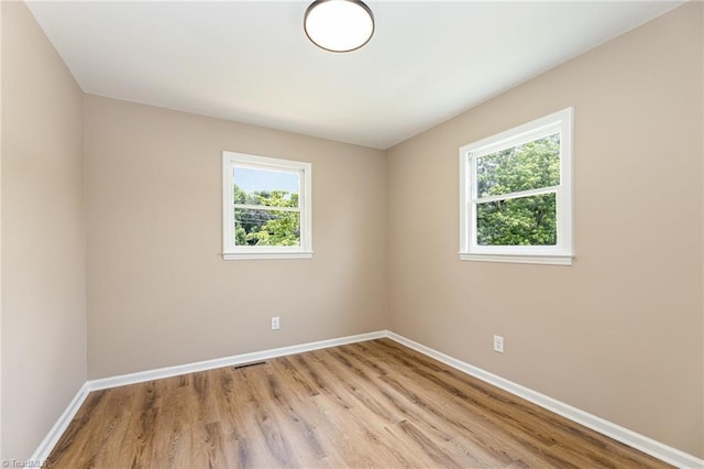 4353 Valley View Rd, Thomasville, NC 27370 - empty room featuring healthy amount of natural light, baseboards, and light wood-style flooring