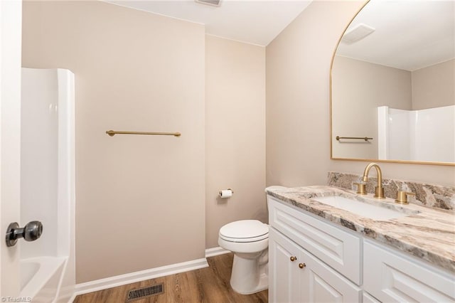 4353 Valley View Rd, Thomasville, NC 27370 - bathroom with wood finished floors, vanity, toilet, and baseboards