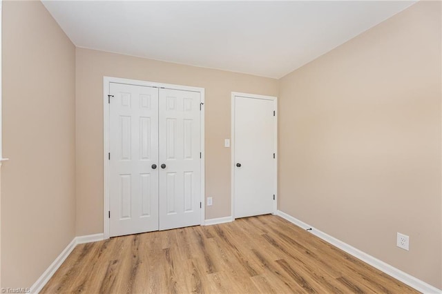 4353 Valley View Rd, Thomasville, NC 27370 - unfurnished bedroom featuring light wood-style floors, baseboards, and a closet
