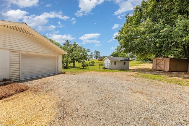 4353 Valley View Rd, Thomasville, NC 27370 - garage with a storage unit and driveway