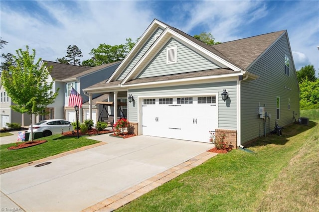 craftsman house featuring central AC, a garage, and a front yard