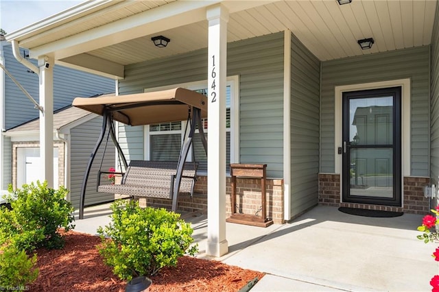 doorway to property with a porch