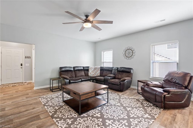 living room with hardwood / wood-style flooring and ceiling fan