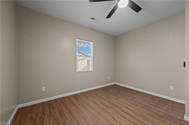 unfurnished room with light hardwood / wood-style flooring and ceiling fan