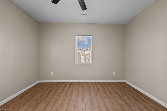 unfurnished room with light hardwood / wood-style flooring and ceiling fan