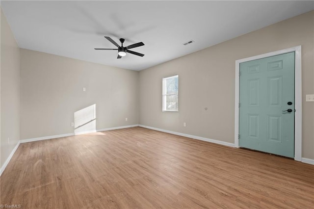 spare room featuring ceiling fan and light hardwood / wood-style floors