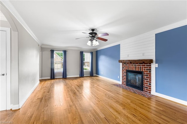 5119 Spiral Wood Dr, Clemmons, NC 27012 - unfurnished living room with ornamental molding, wood finished floors, ceiling fan, and a fireplace