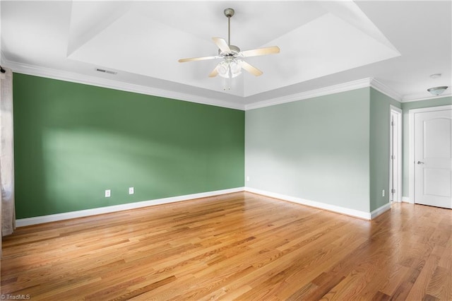 5119 Spiral Wood Dr, Clemmons, NC 27012 - unfurnished room featuring wood finished floors, ceiling fan, ornamental molding, and a raised ceiling