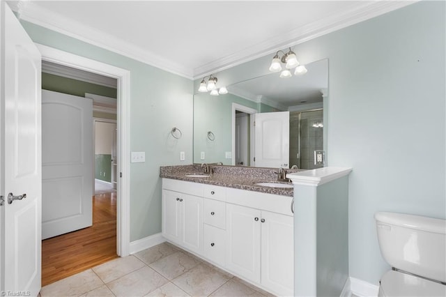 5119 Spiral Wood Dr, Clemmons, NC 27012 - bathroom featuring double vanity, ornamental molding, and a shower with door