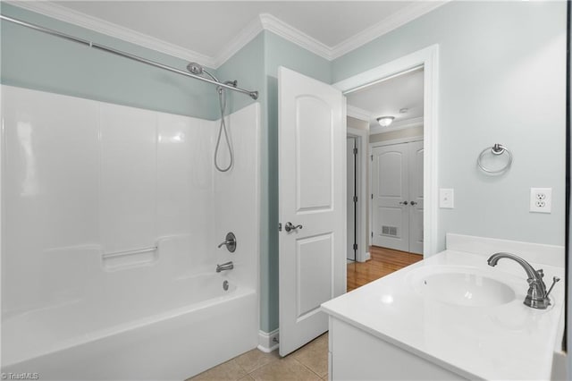 5119 Spiral Wood Dr, Clemmons, NC 27012 - bathroom with ornamental molding, vanity, tub / shower combination, and tile patterned floors