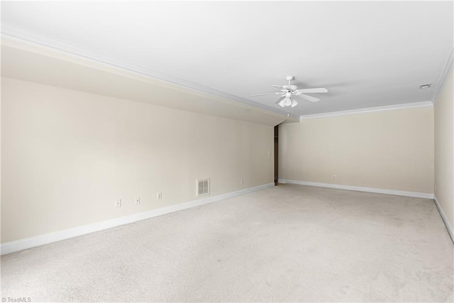 5119 Spiral Wood Dr, Clemmons, NC 27012 - spare room featuring ornamental molding, light colored carpet, and a ceiling fan