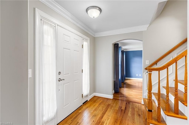 5119 Spiral Wood Dr, Clemmons, NC 27012 - entryway with arched walkways, ornamental molding, light wood-style flooring, and stairway