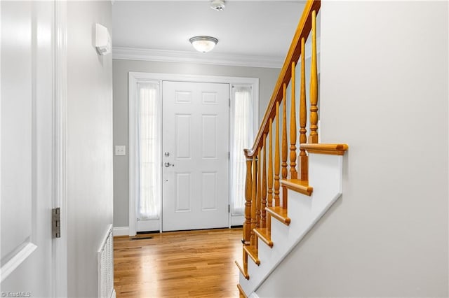 5119 Spiral Wood Dr, Clemmons, NC 27012 - entrance foyer with crown molding, wood finished floors, and stairway