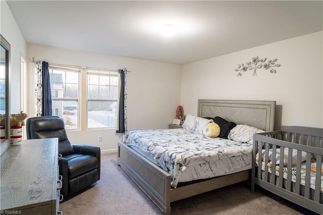 bedroom featuring light carpet