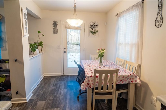 dining area with dark wood-type flooring