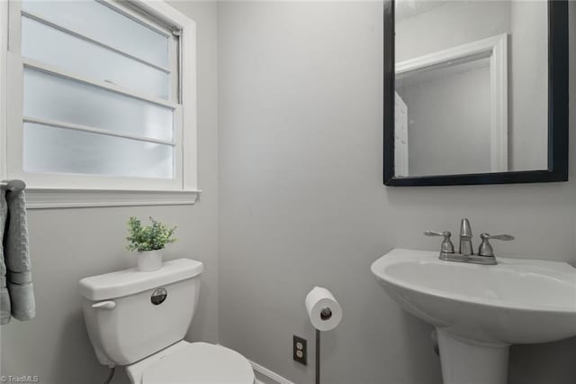 bathroom featuring toilet and sink