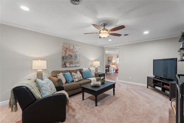 living room with light carpet, ceiling fan, and ornamental molding