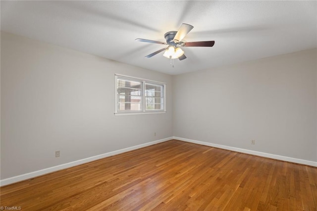 unfurnished room featuring ceiling fan and light hardwood / wood-style flooring