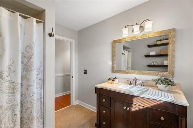 bathroom with tile patterned floors and vanity